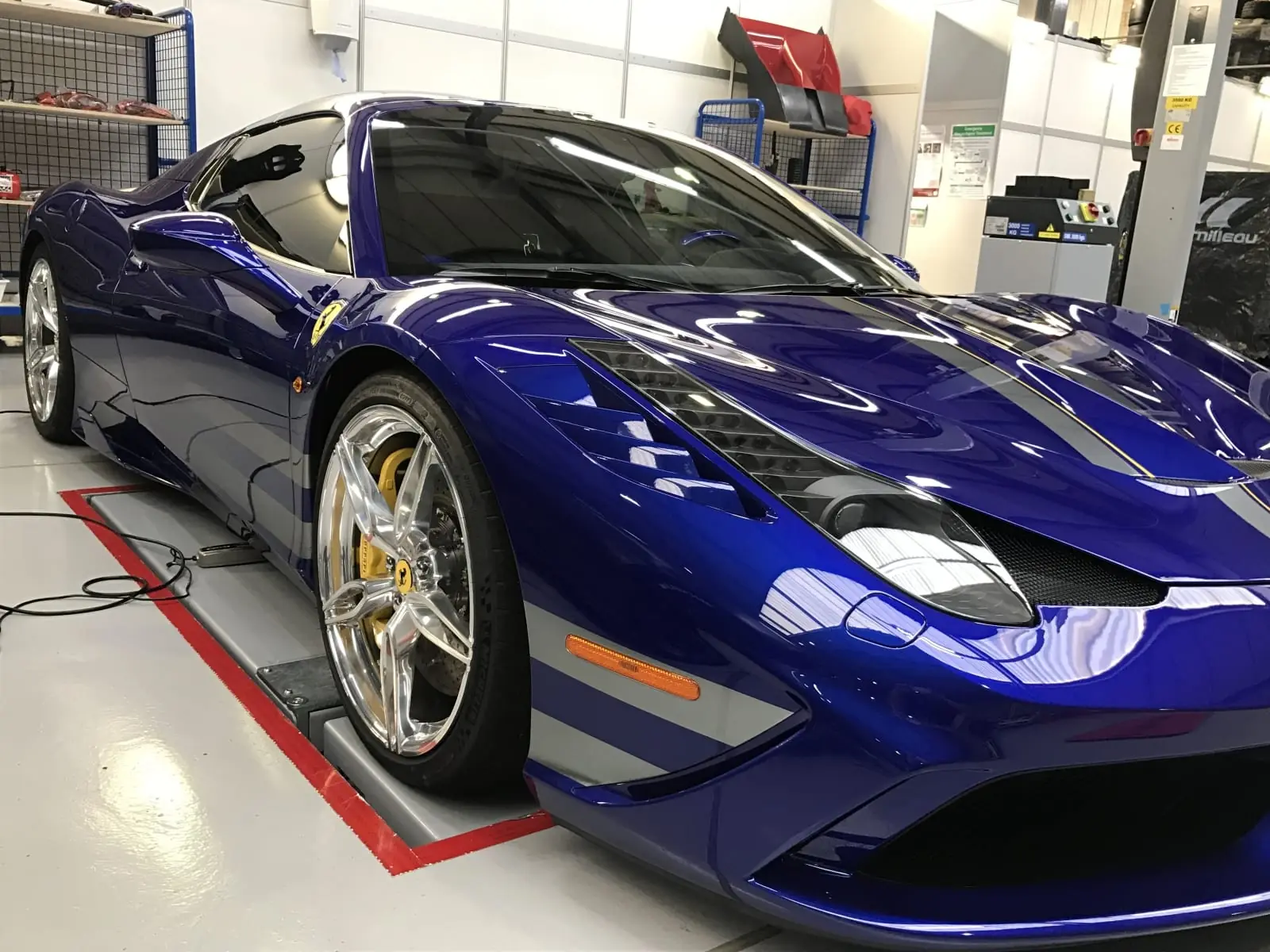 Blue Ferrari in the detailing studio after paint correction